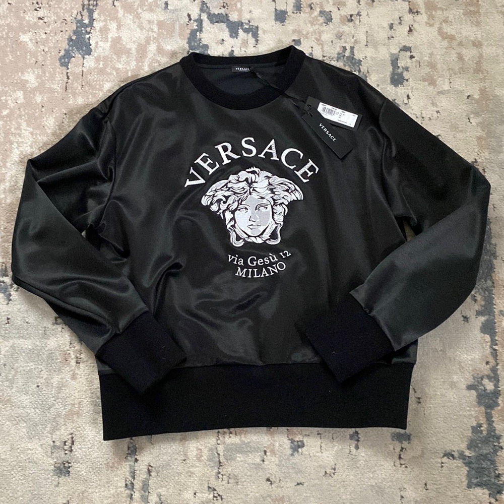 Black and white women’s Versace sweater, size 44, new with tags, hanger and bag